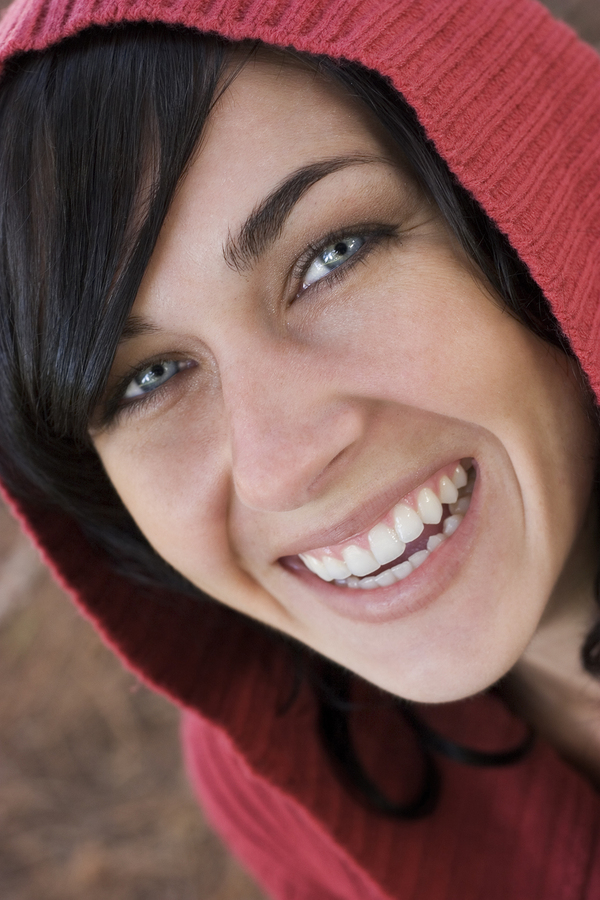 Smiling Woman red hoodie nice teeth dental implants Woburn, MA